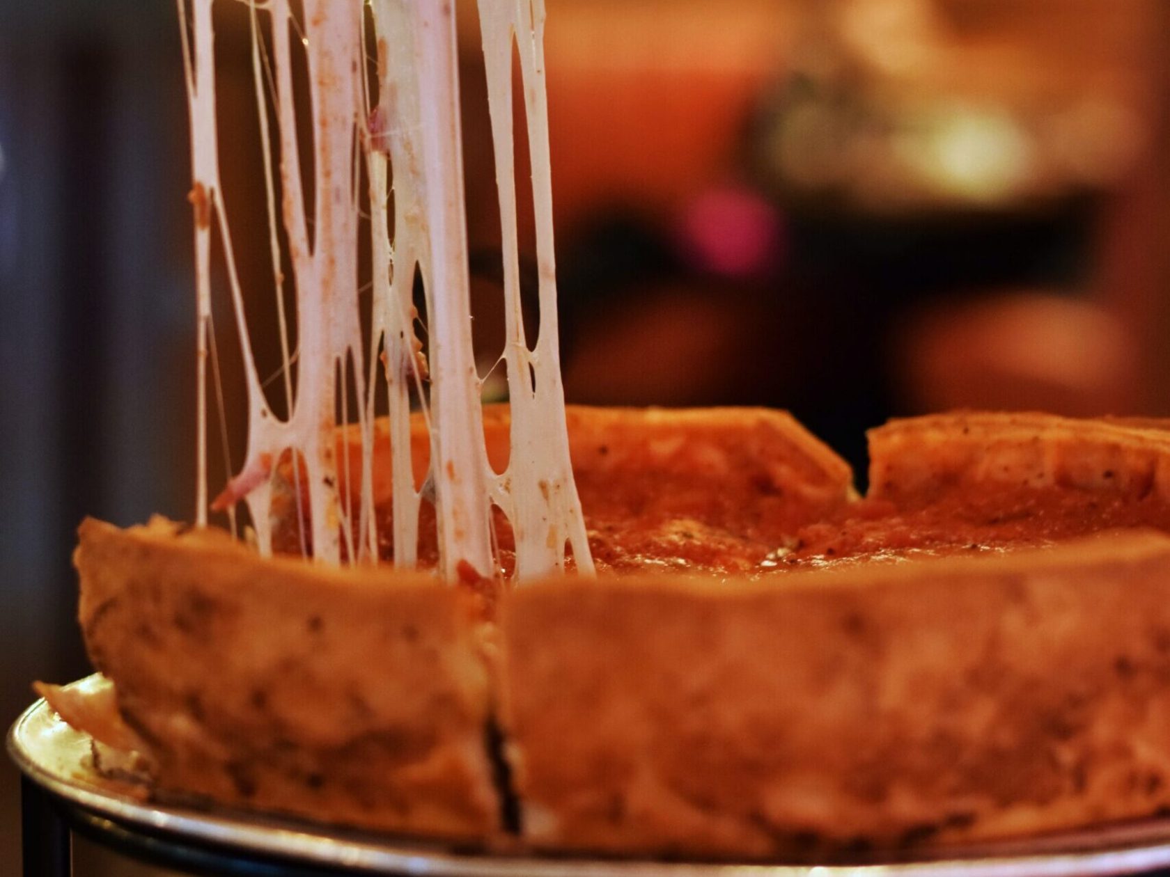 a close up of a deep dish pizza on a plate